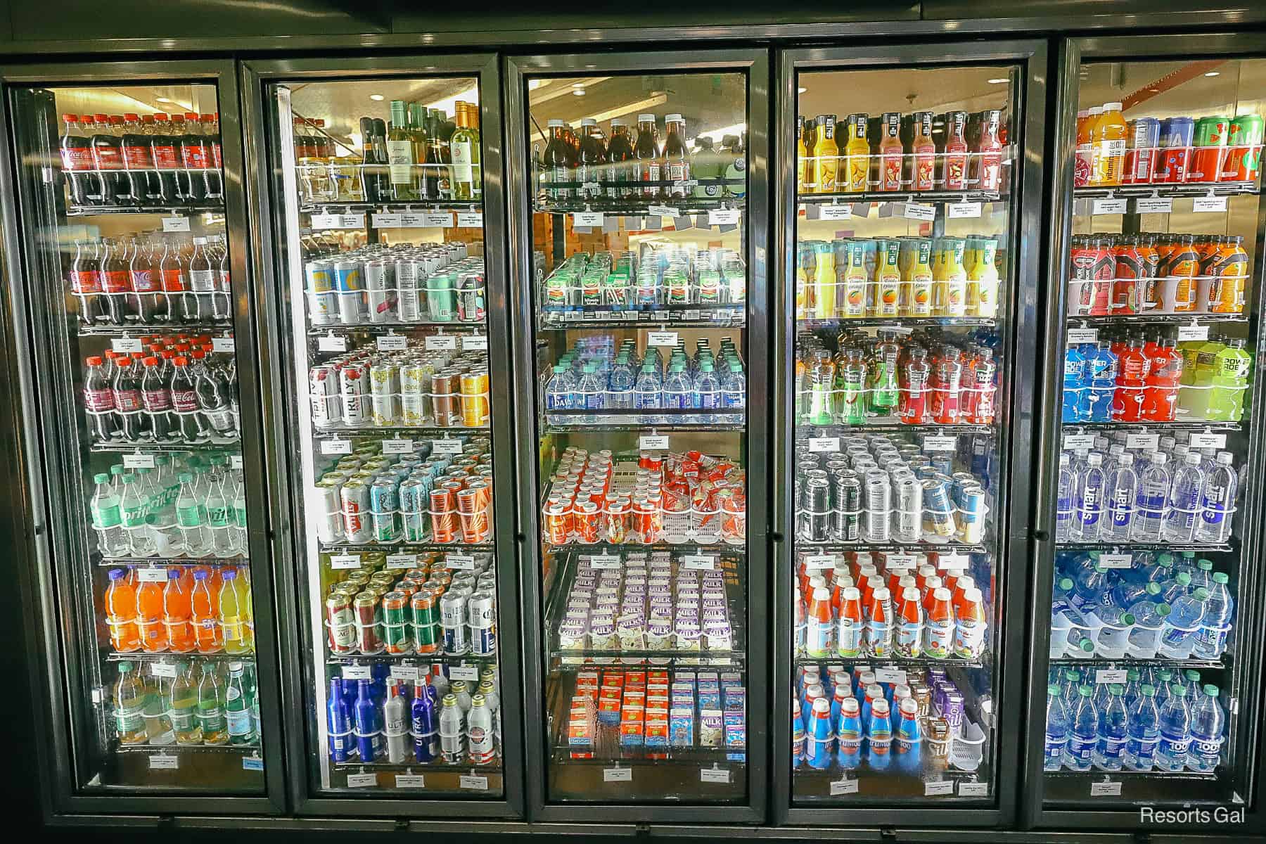 a refrigerated case with grab and go beverages inside Art of Animation 