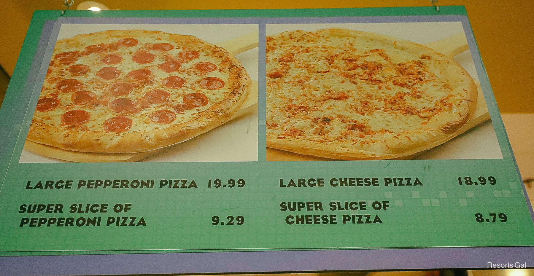 a menu that shows a large slice of pizza and a whole pizza option at Art of Animation 