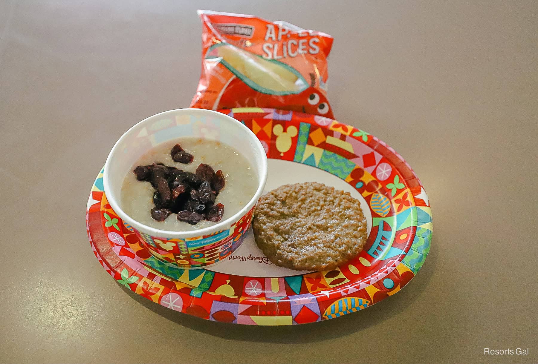 a kids' meal of oatmeal with dried cranberries and turkey sausage at Art of Animation 