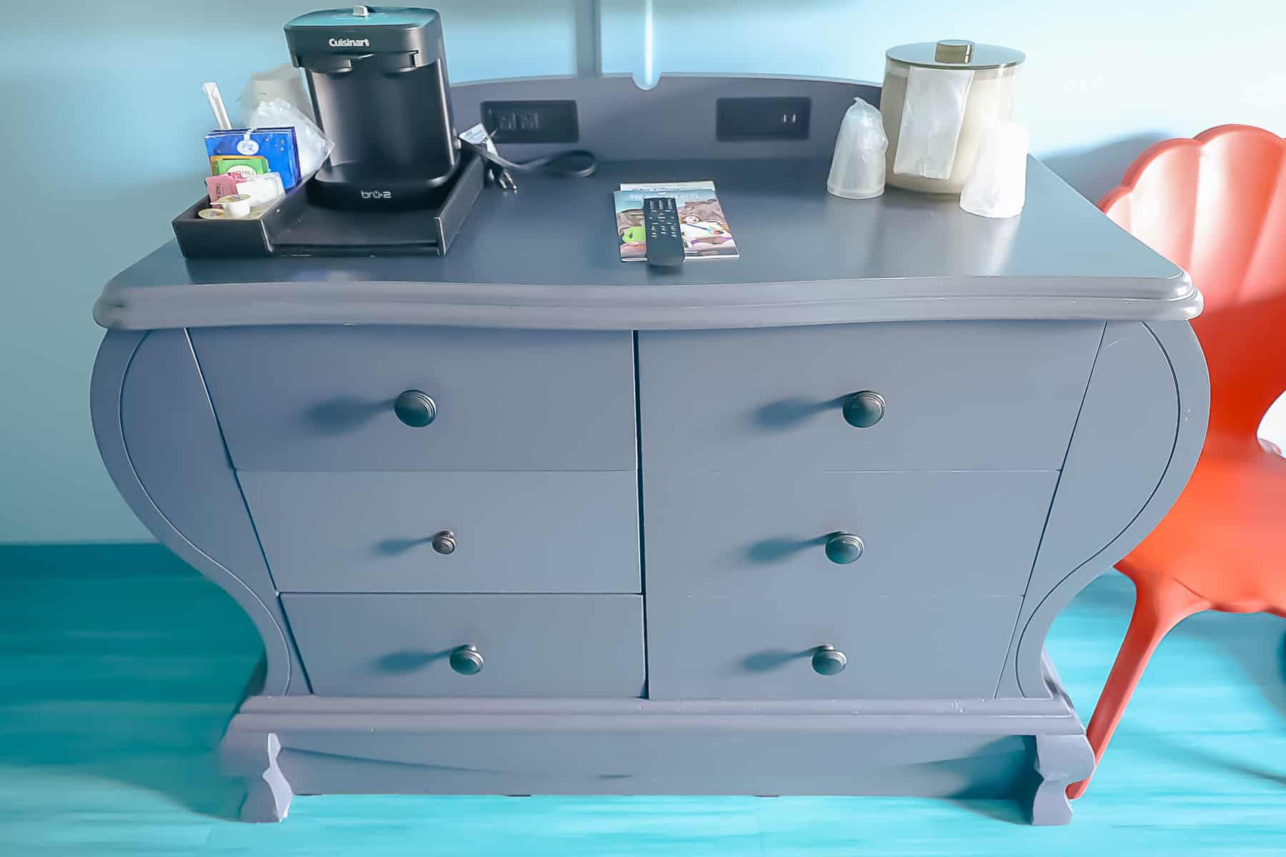 A dresser with storage area in the Little Mermaid rooms at Art of Animation. 
