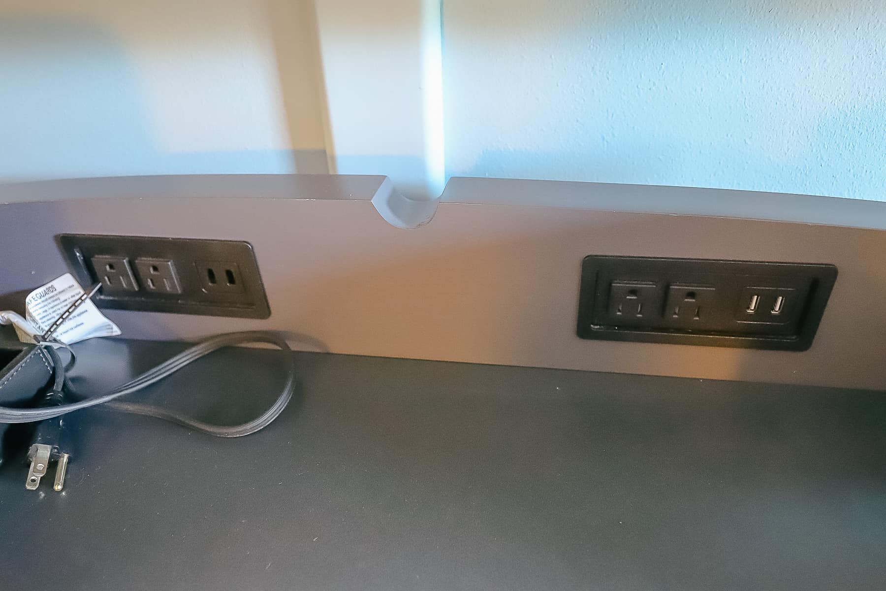 shows outlets and USB ports above the dresser 