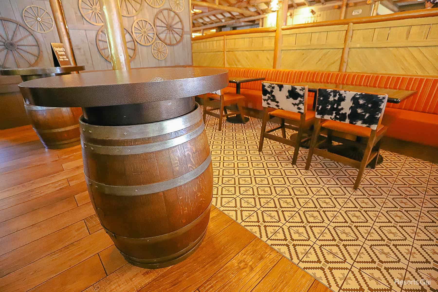 cow hide decorations and barrel tables in Crockett's Tavern 