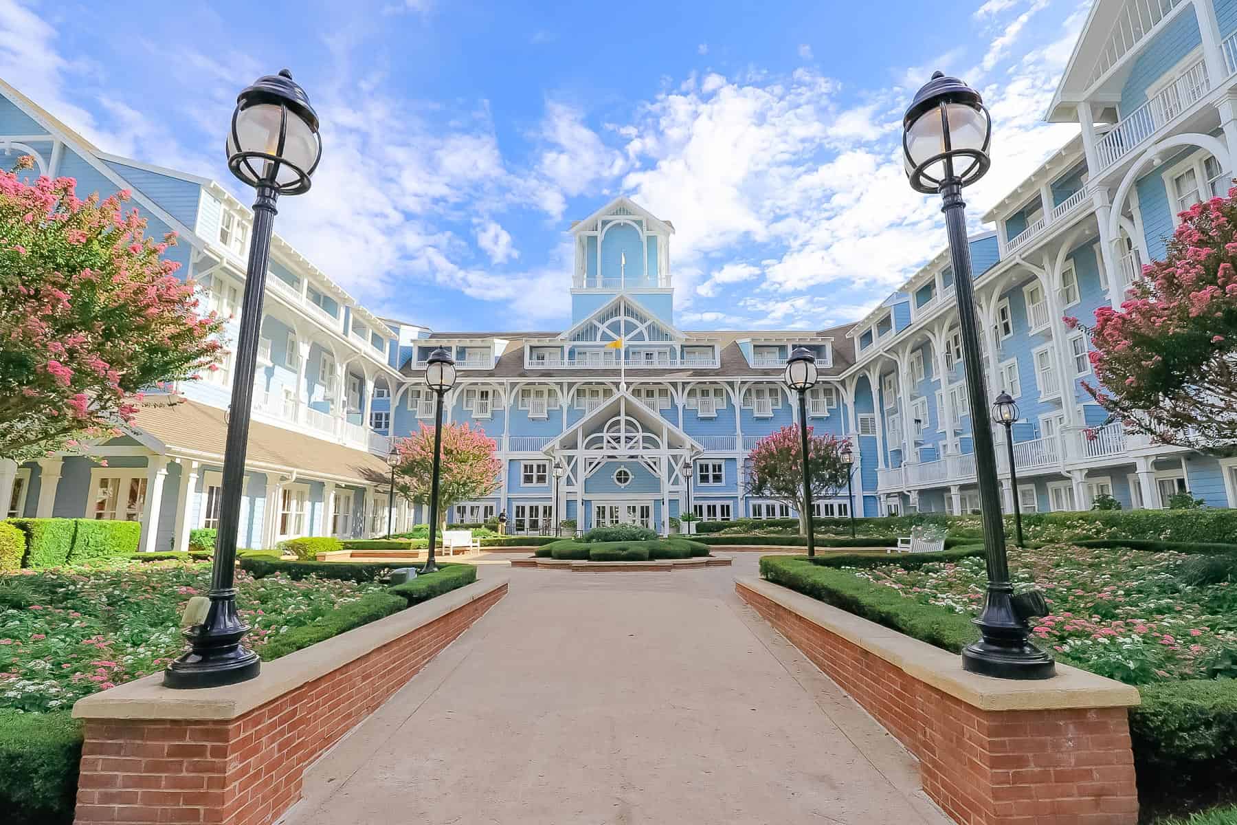 Disney's Beach Club with blue siding when the pink crepe myrtles are in bloom 