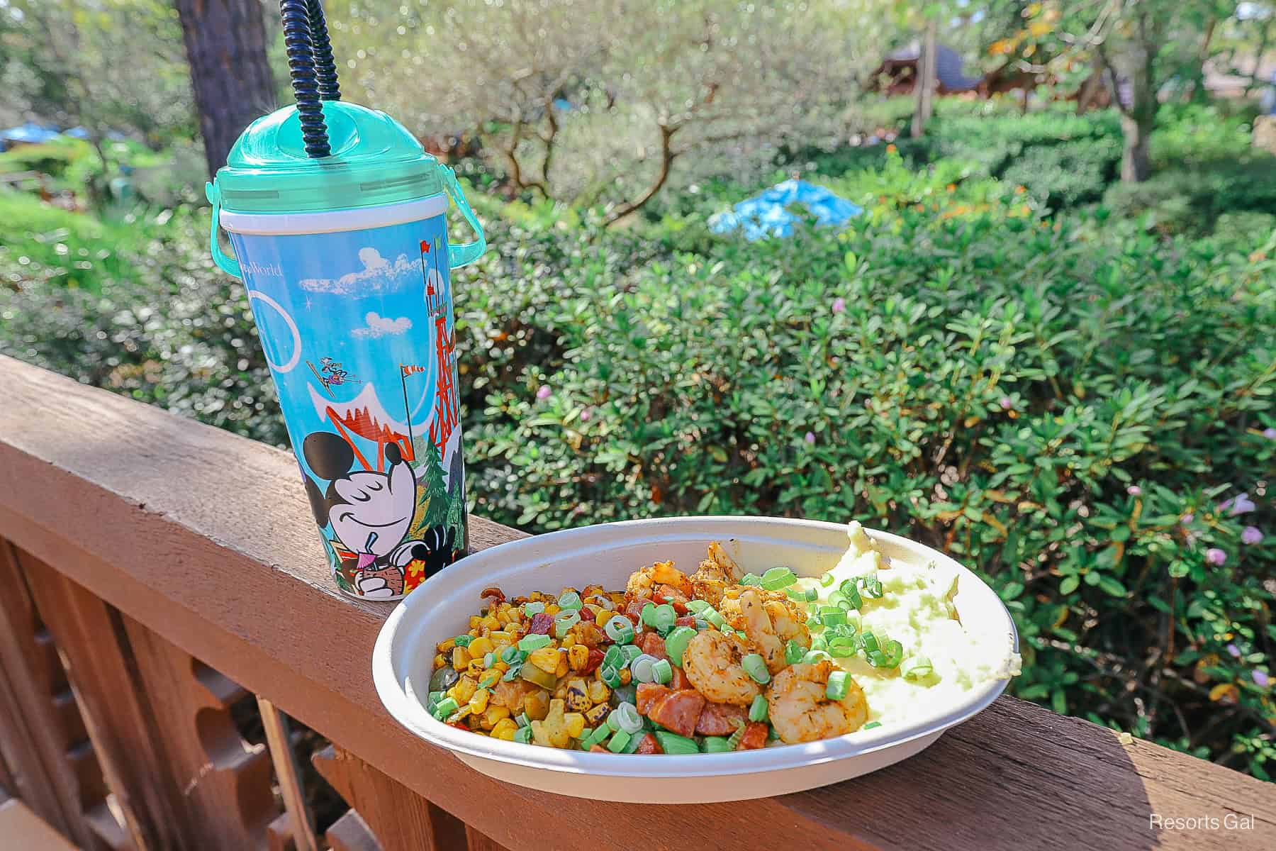 a shrimp with grits dish and a refillable mug from Disney's Blizzard Beach 