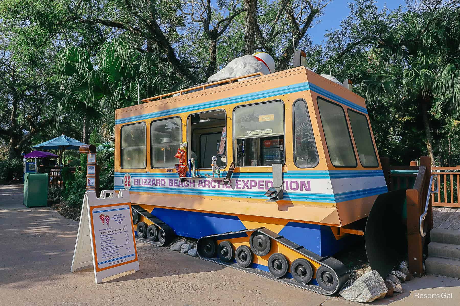 a yellow and blue snack stand that looks like a snow plow at Blizzard Beach 