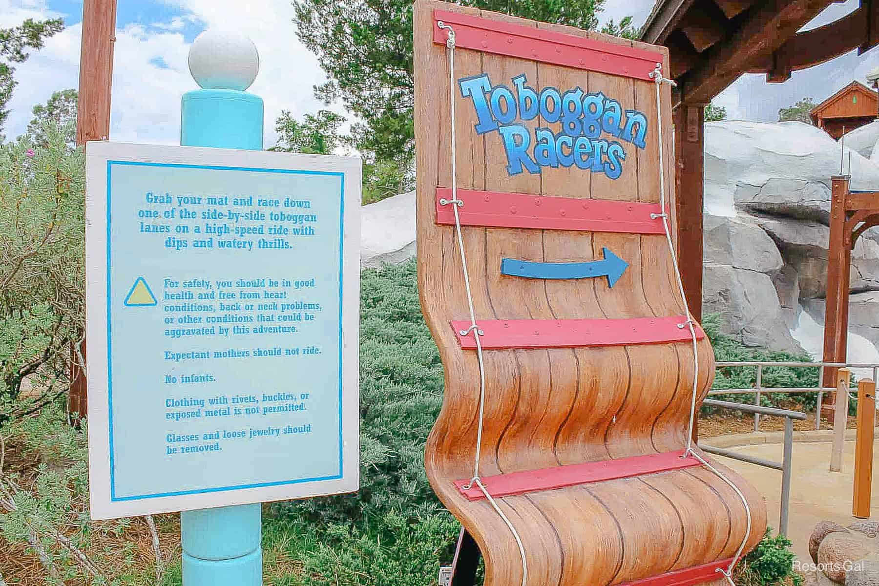 Toboggan Racers attraction signage with rules and restrictions 