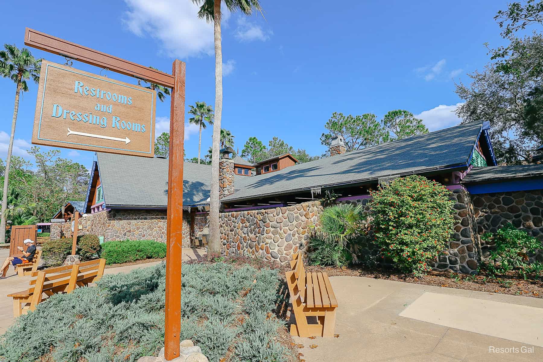 signage that points to restrooms and dressings rooms with a towel return at Blizzard Beach