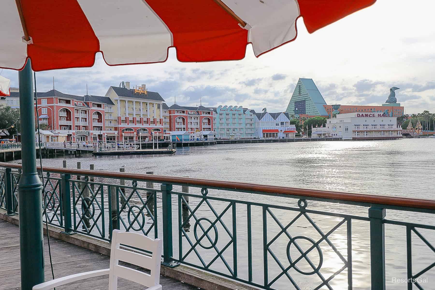 a view of the Boardwalk from a table and chairs with a red and white umbrella 