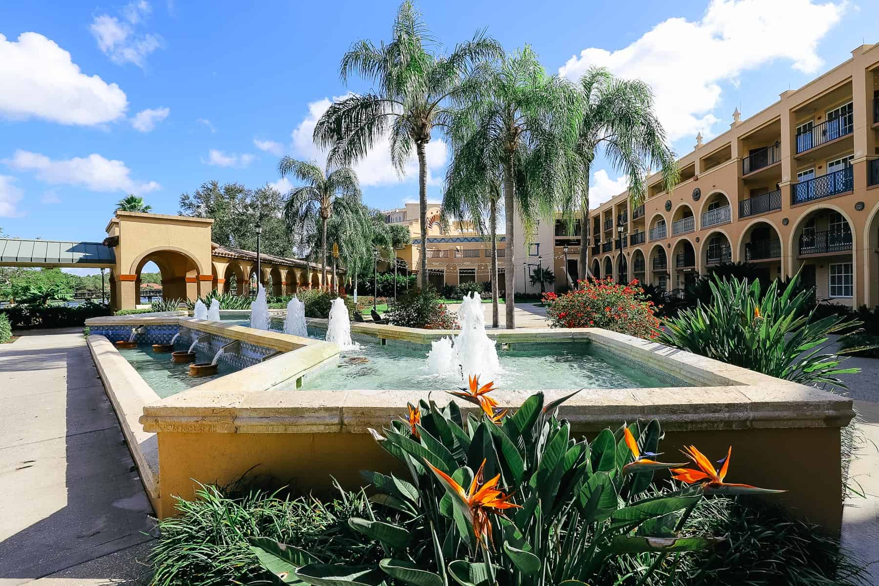 a scenic fountain with palm trees at Disney's Coronado Springs 