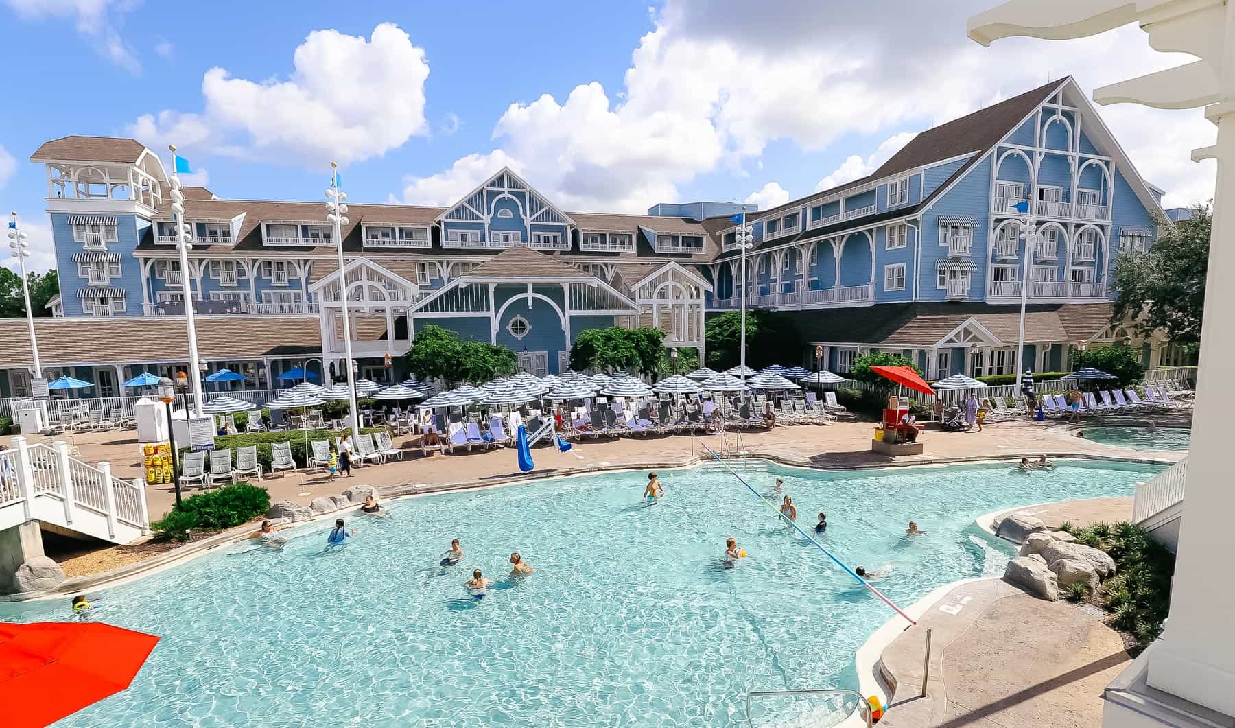 guests using the pool at a Disney Deluxe Hotel 