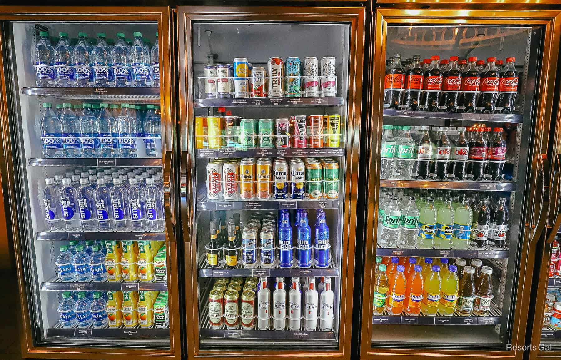 a refrigerated case with sodas, drinks, and water at Trail's End 