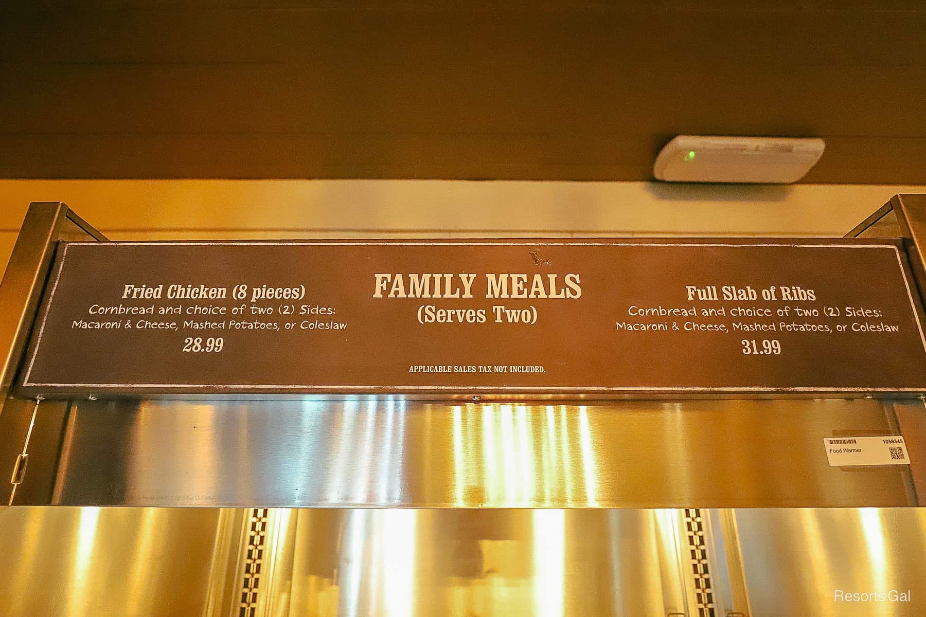 a sign that says family meals and lists the types of prices 
