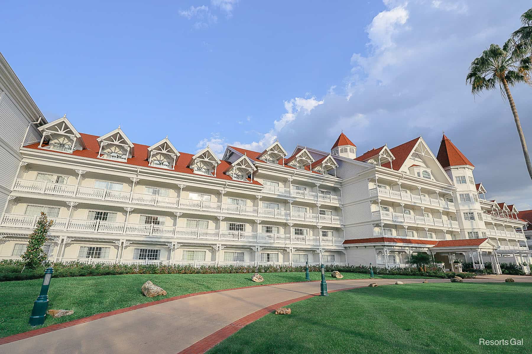 green grass, white resort with red roof, Grand Floridian 