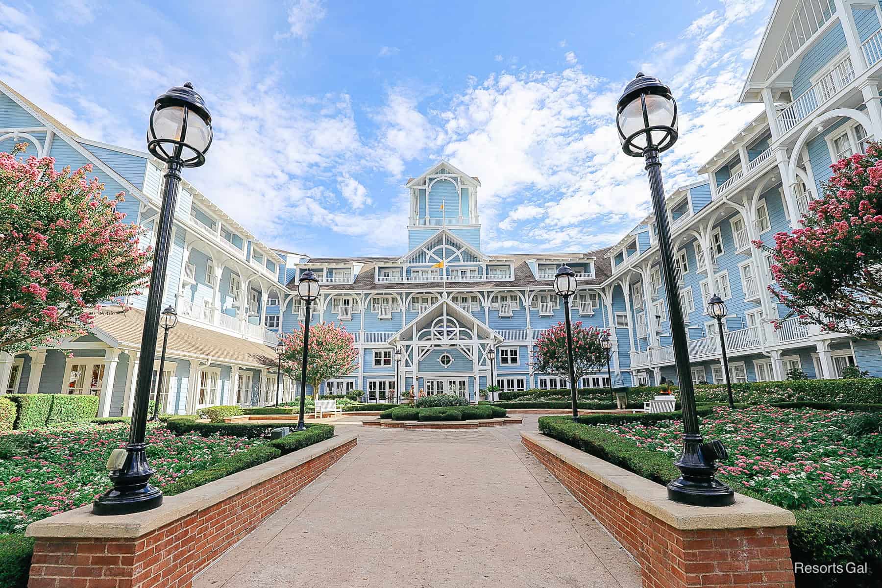 a scenic photo of Disney's Beach Club with pink crepe myrtles in bloom 