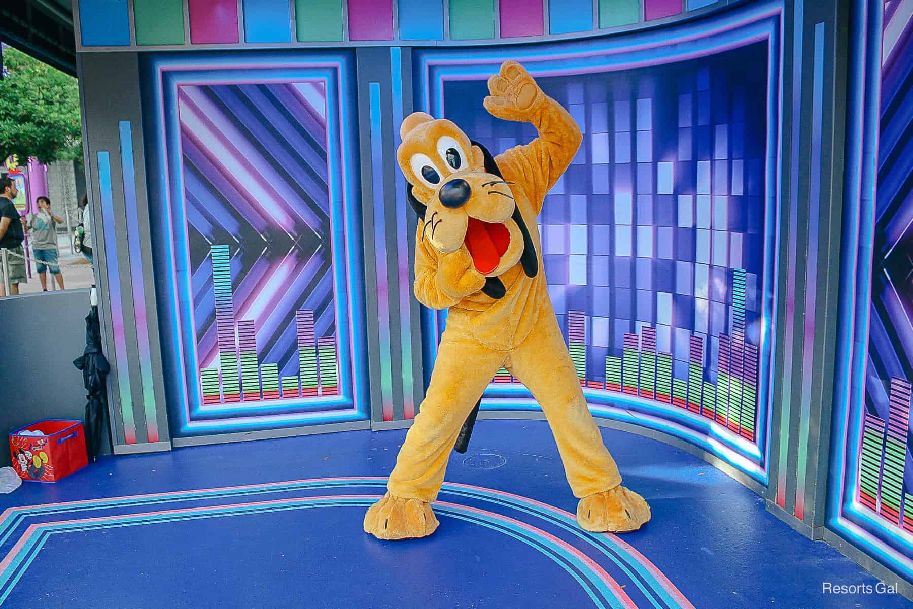 Pluto waves as one of the four characters who meet in the Disney Junior area of Hollywood Studios 