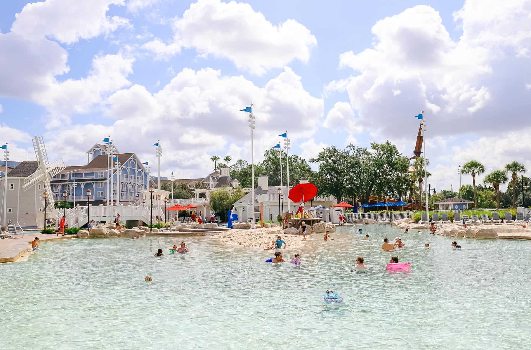 a children's pool area with a sand pile in the center 