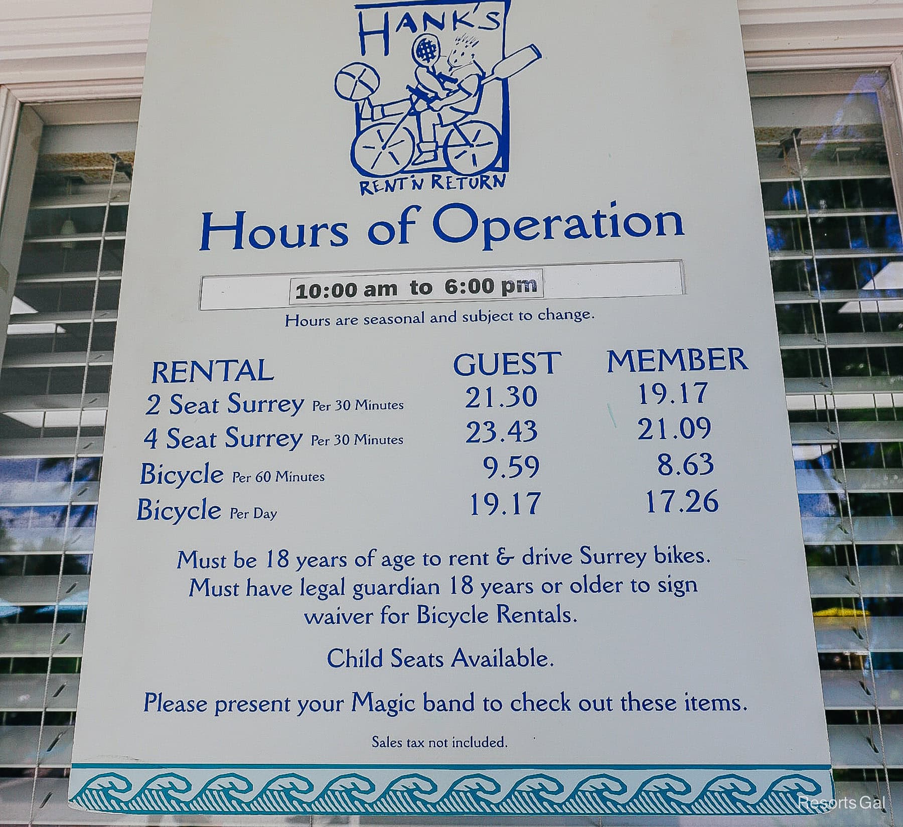 a sign with hours and prices for bike rentals at Old Key West 