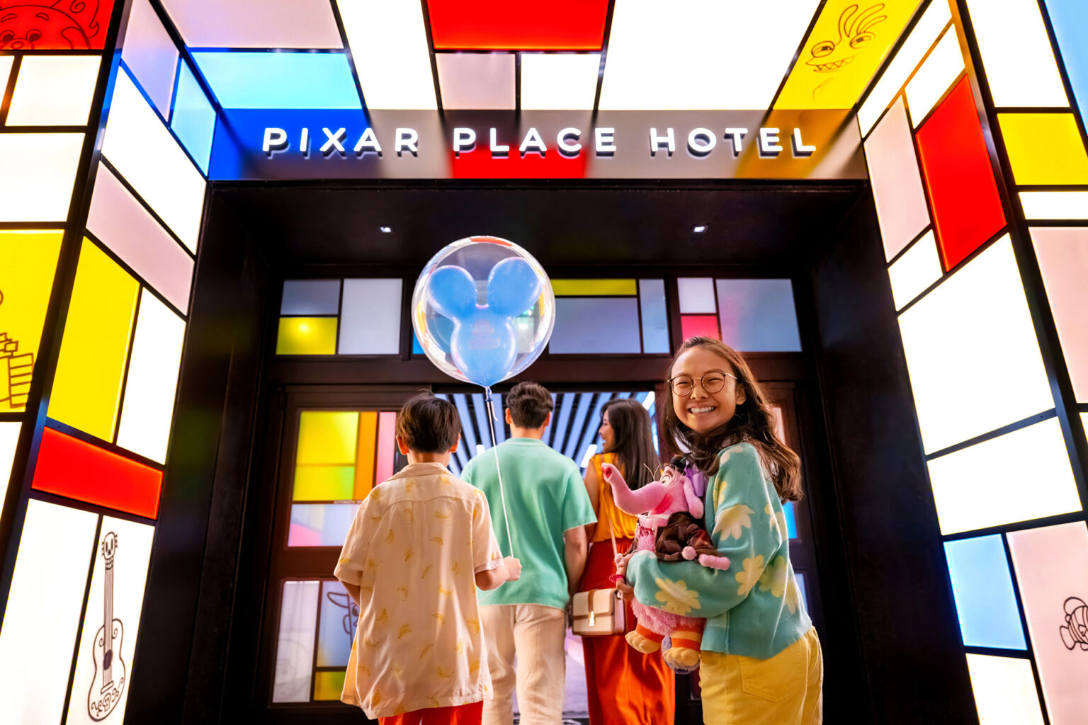 Disney Pixar Place Hotel with guests entering.