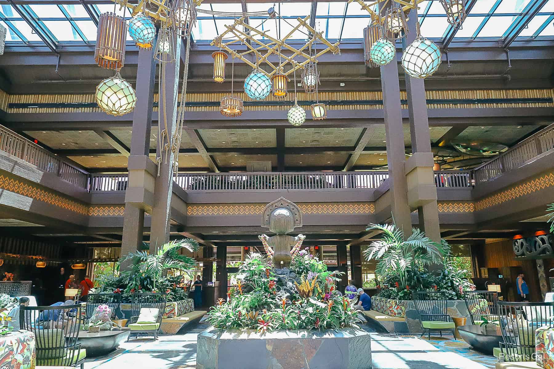 the lobby of the Polynesian with tiki statue sitting in the center 