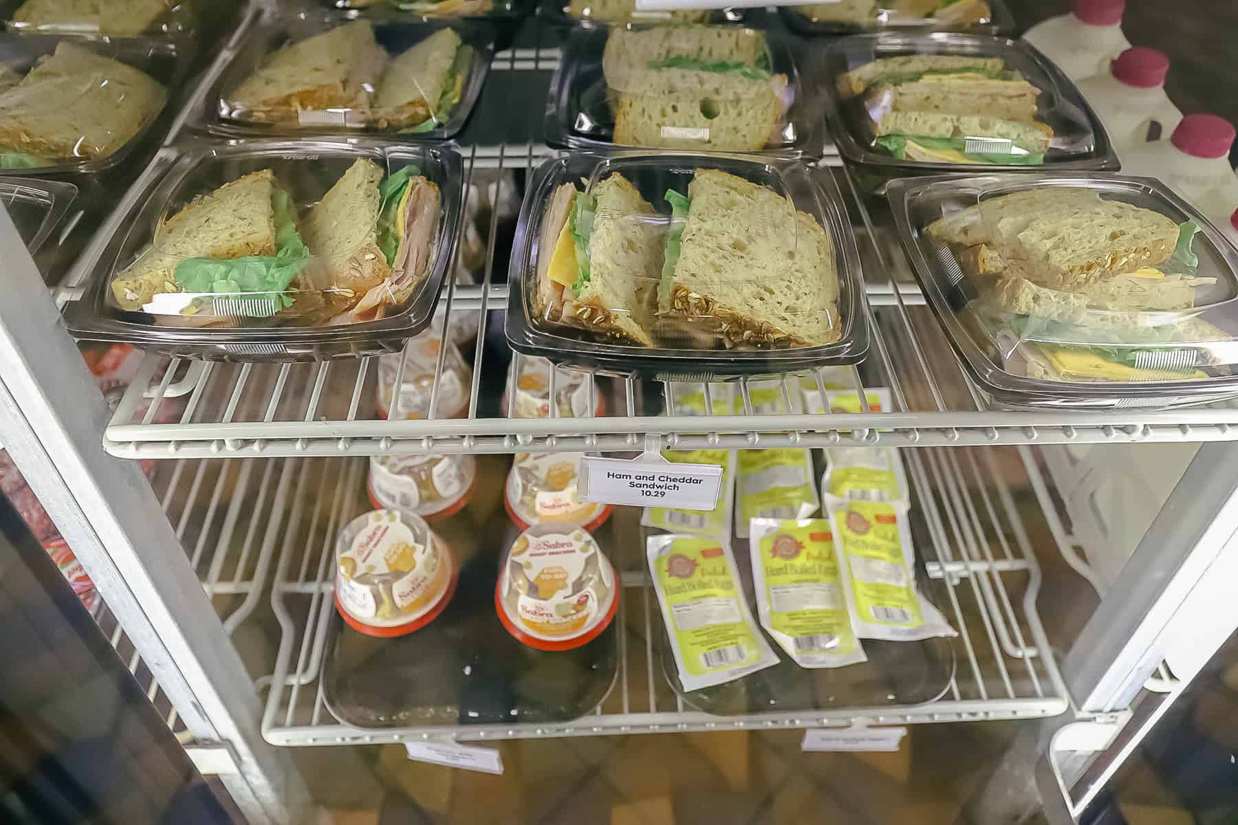 a refrigerated case with premade sandwiches 