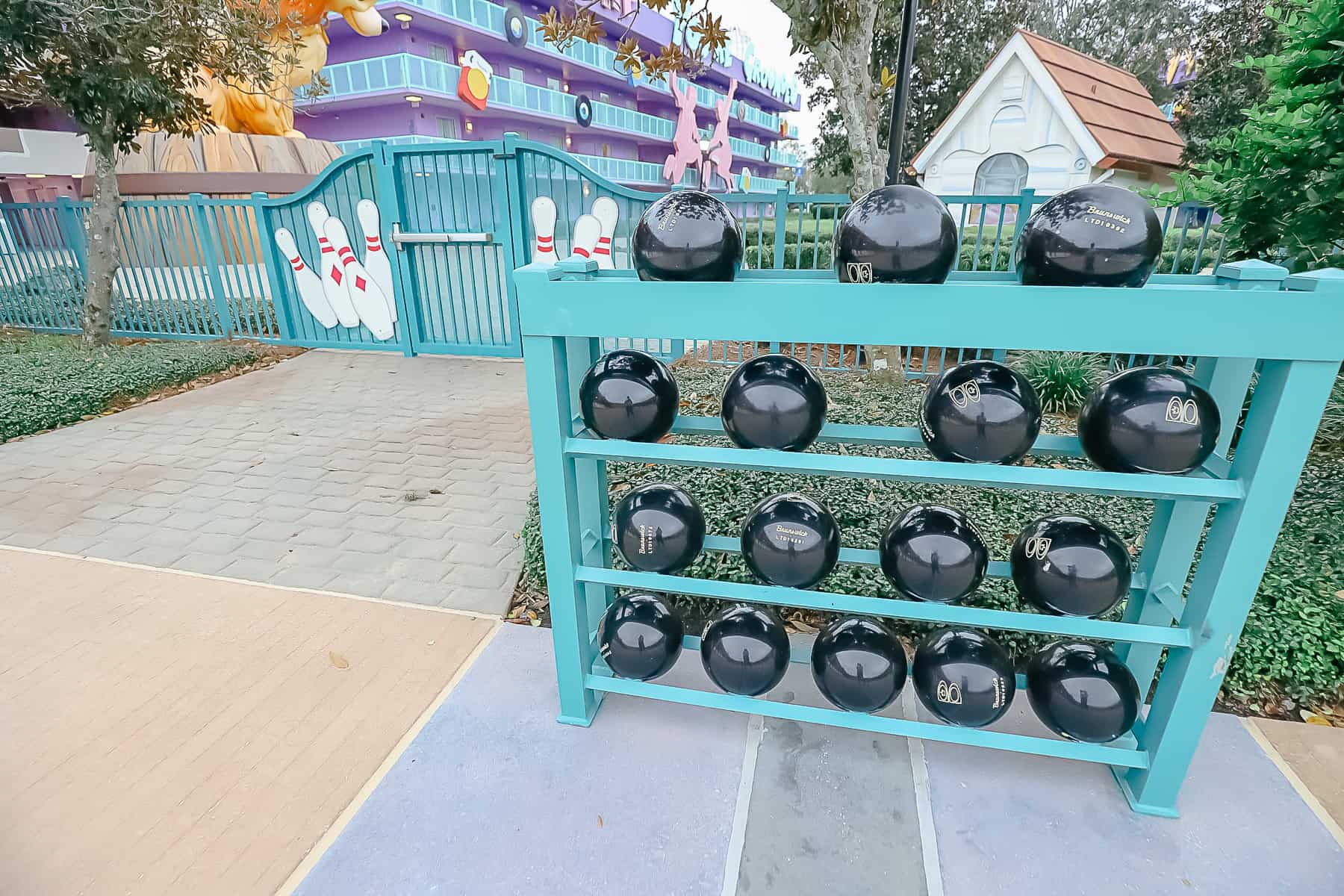 A rack of faux bowling balls is part of the theming at the Bowling Pool.