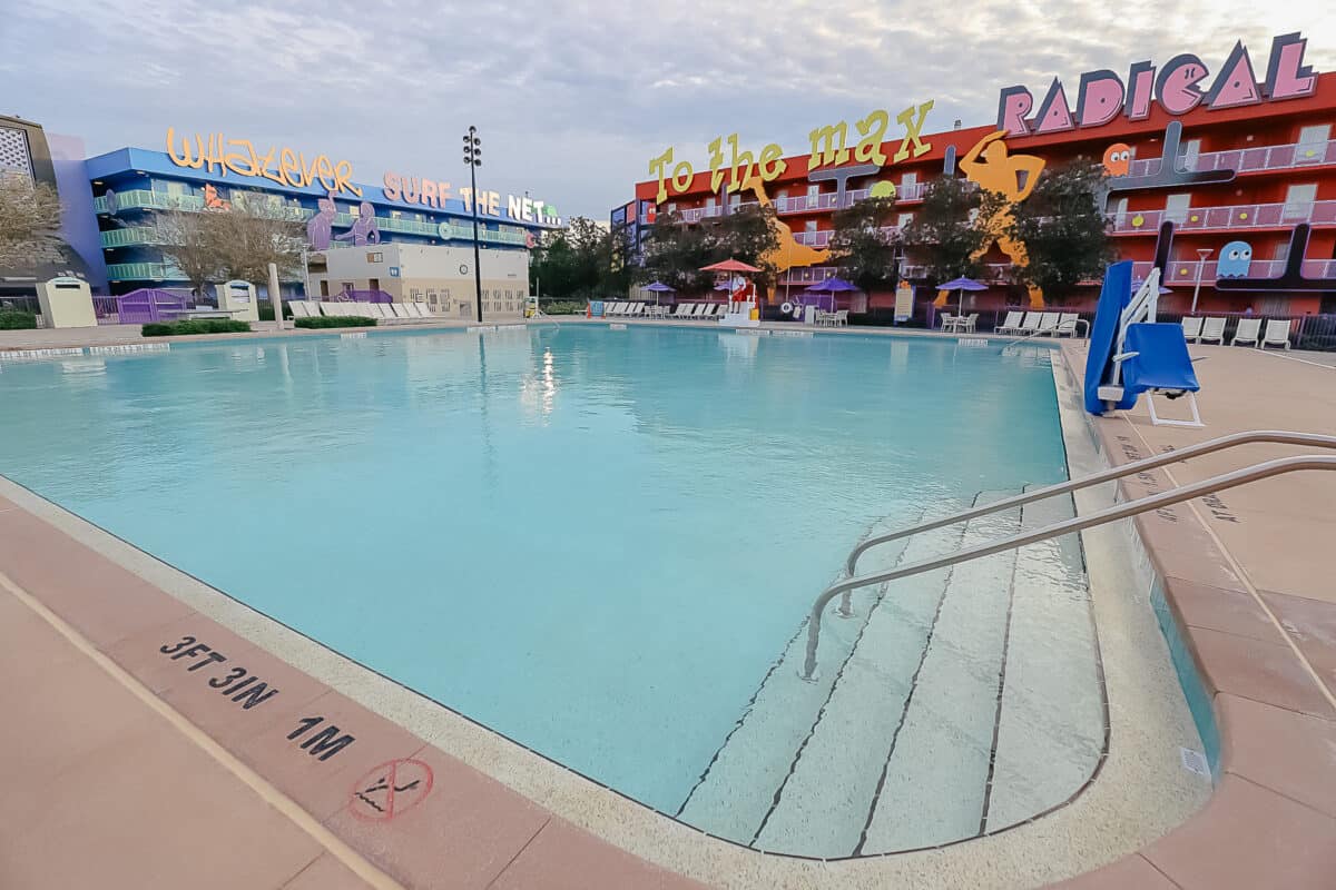 a step entry into the pool on one corner at Pop Century 