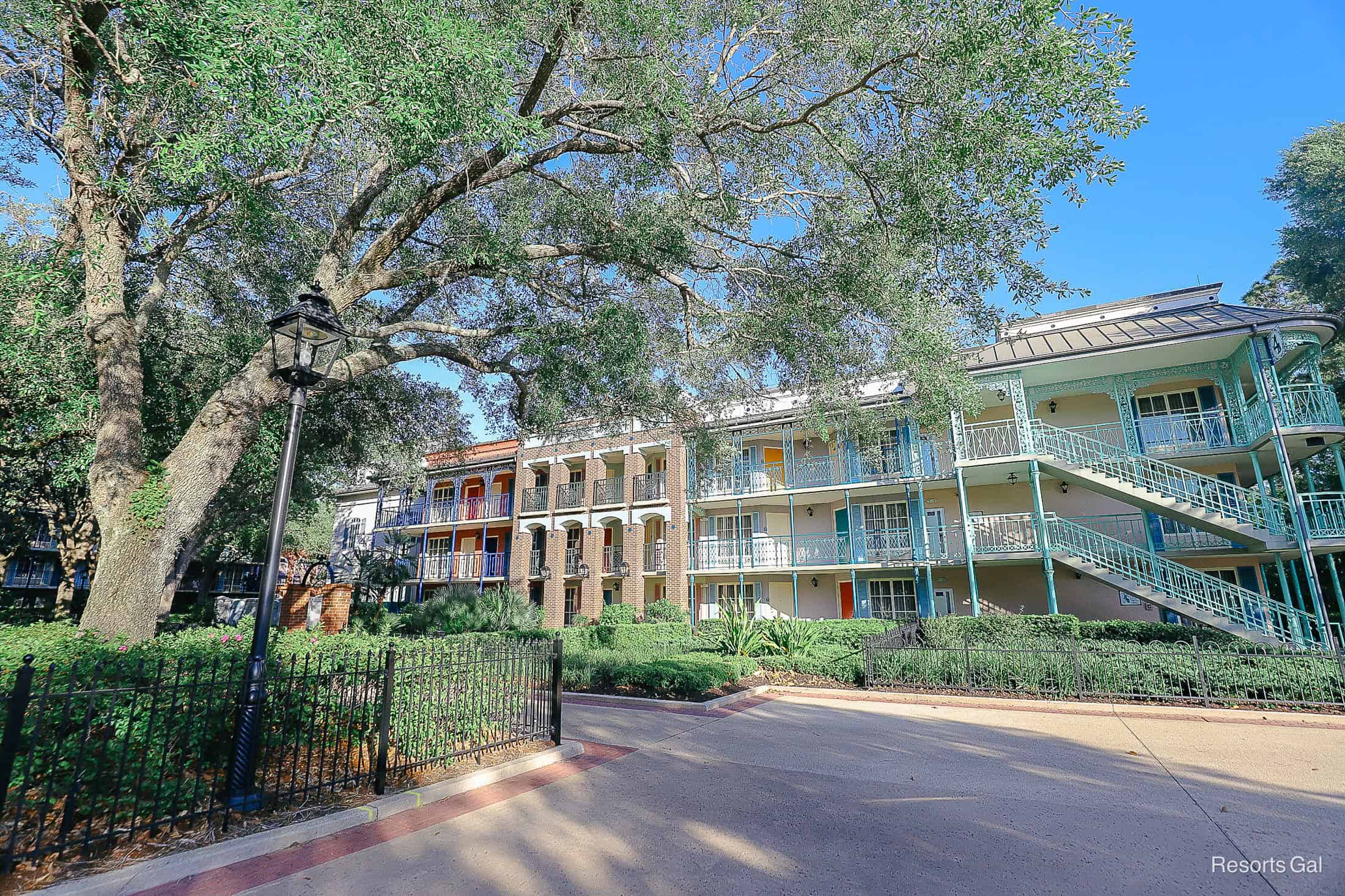 Disney's Port Orleans French Quarter with pretty shade trees and vibrant paint colors 