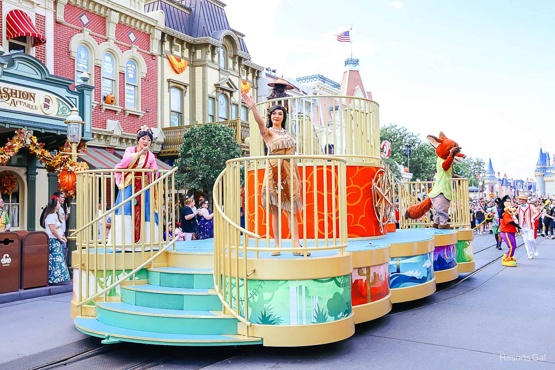 Pocahontas waves to guests from a cavalcade float. 