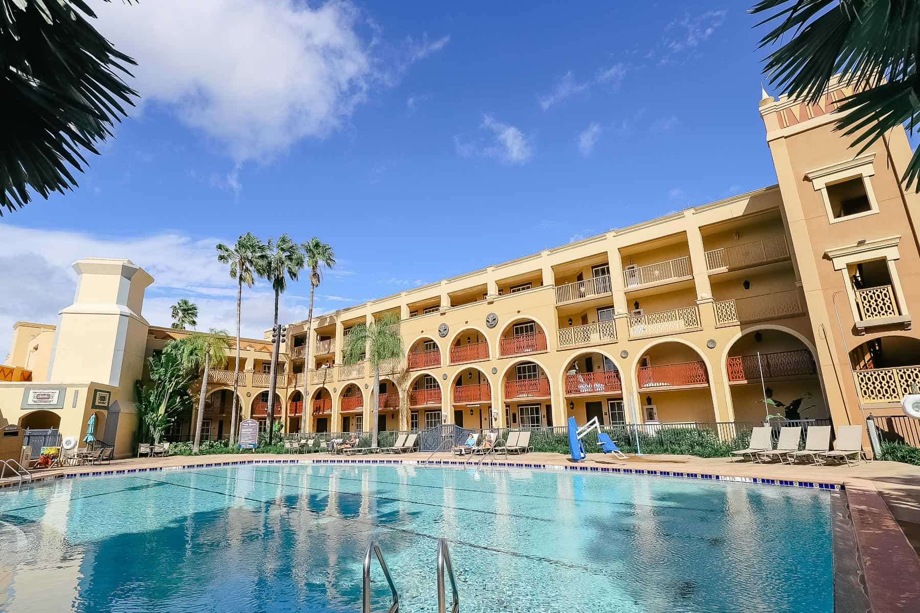 Coronado Springs with a pool and blue skies 