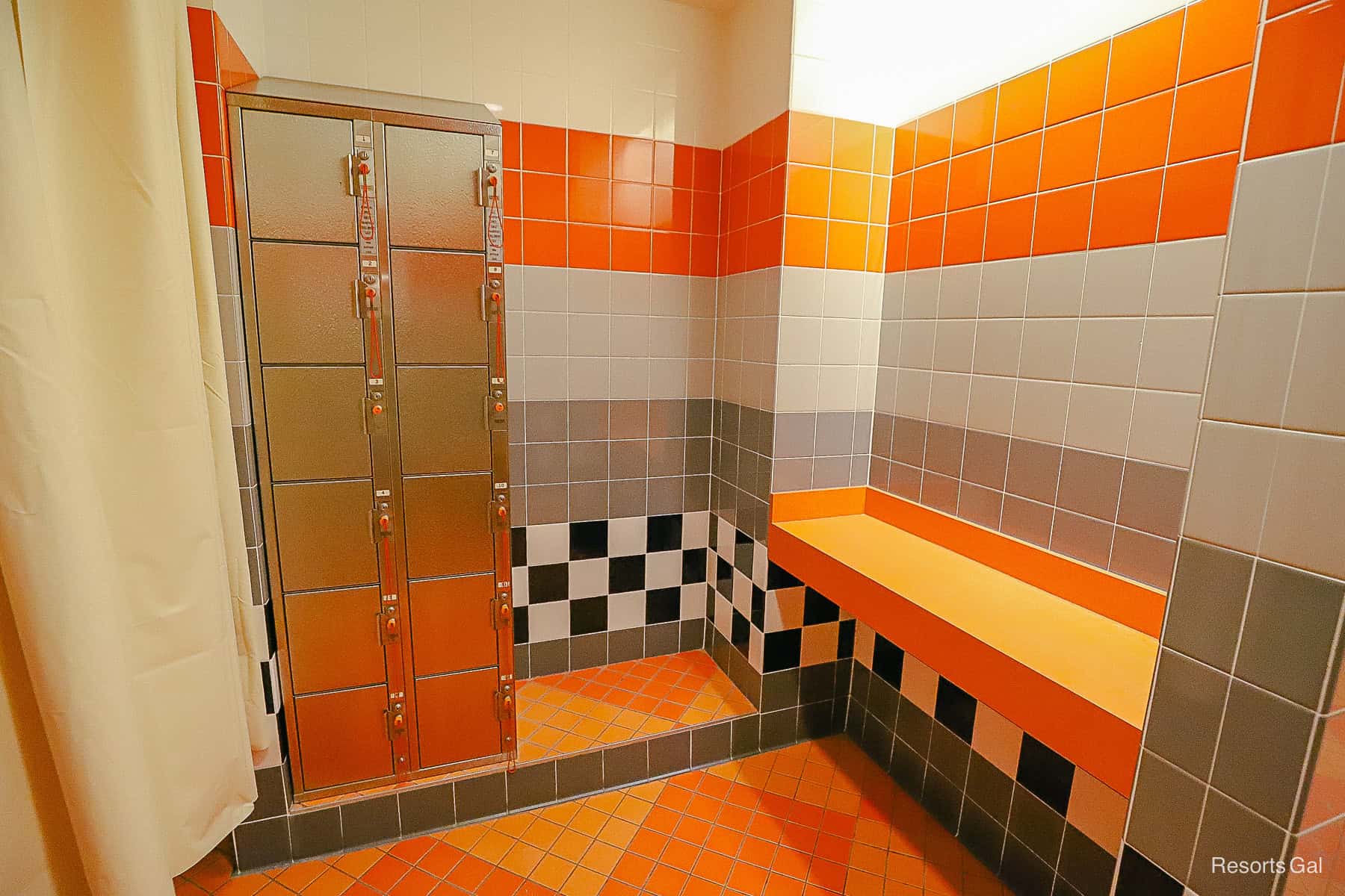 orange, grey, and black tile in the pool changing area at Art of Animation 