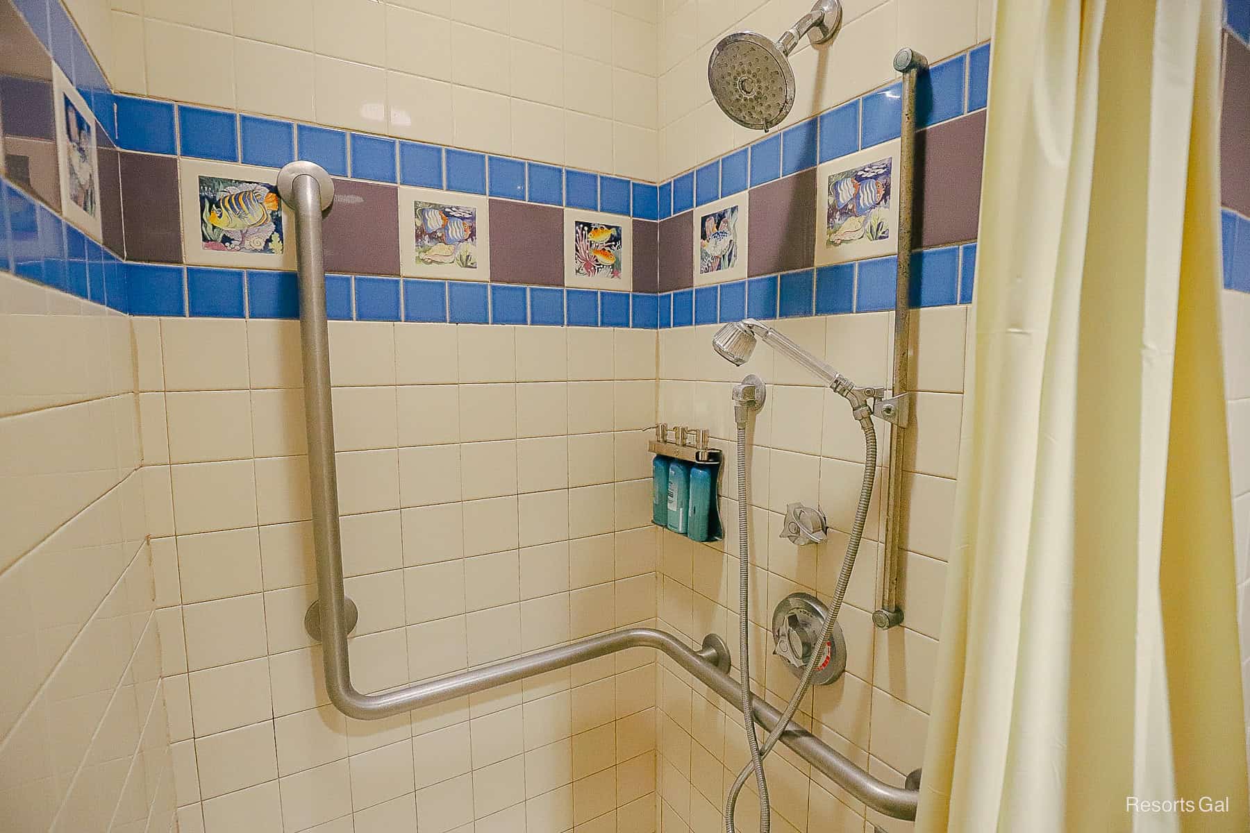 a walk-in shower with toiletries like shampoo. conditioner, and body wash at Disney's Caribbean Beach 