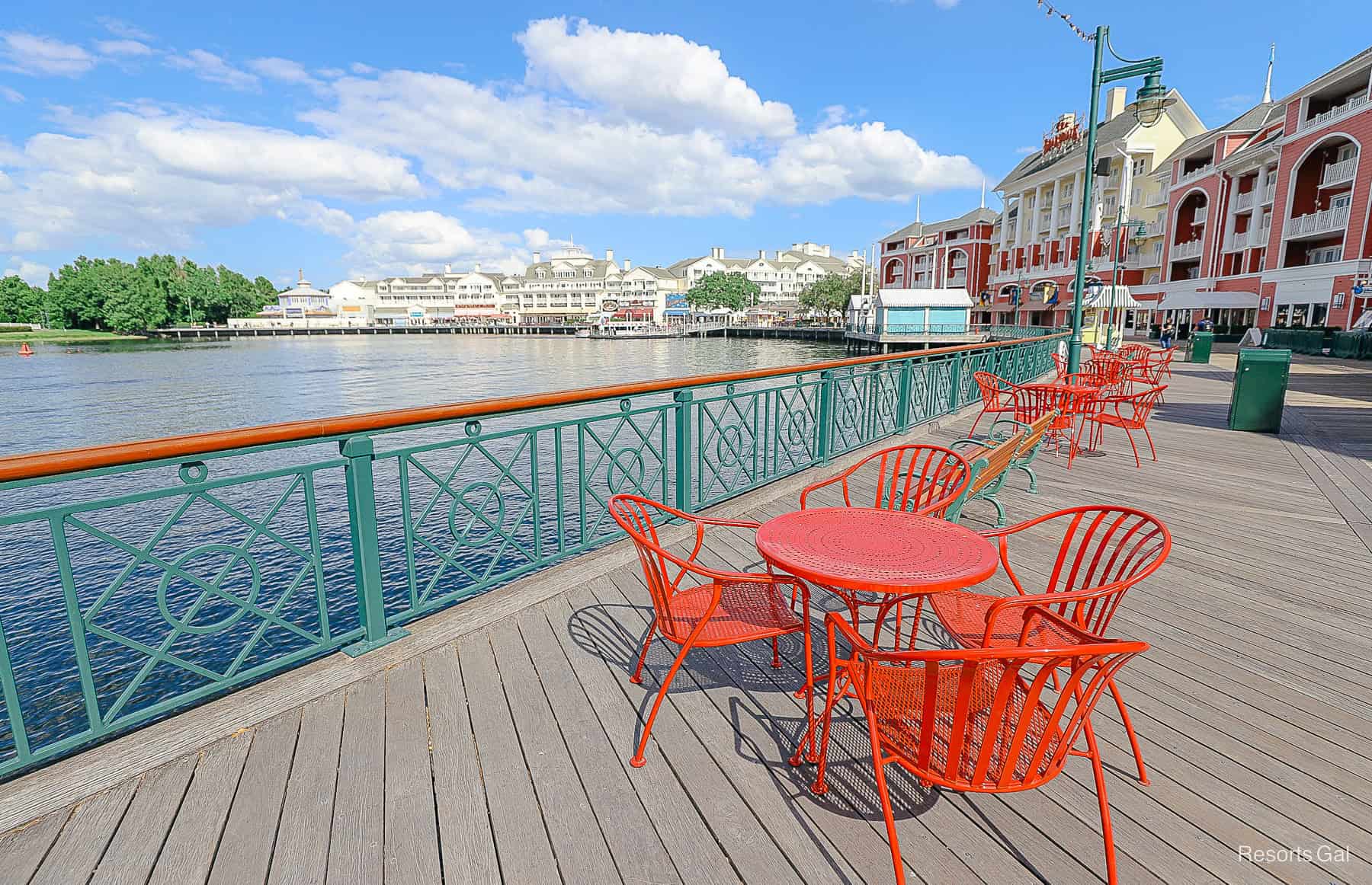 red tables and chairs sitting on Disney's Boardwalk 