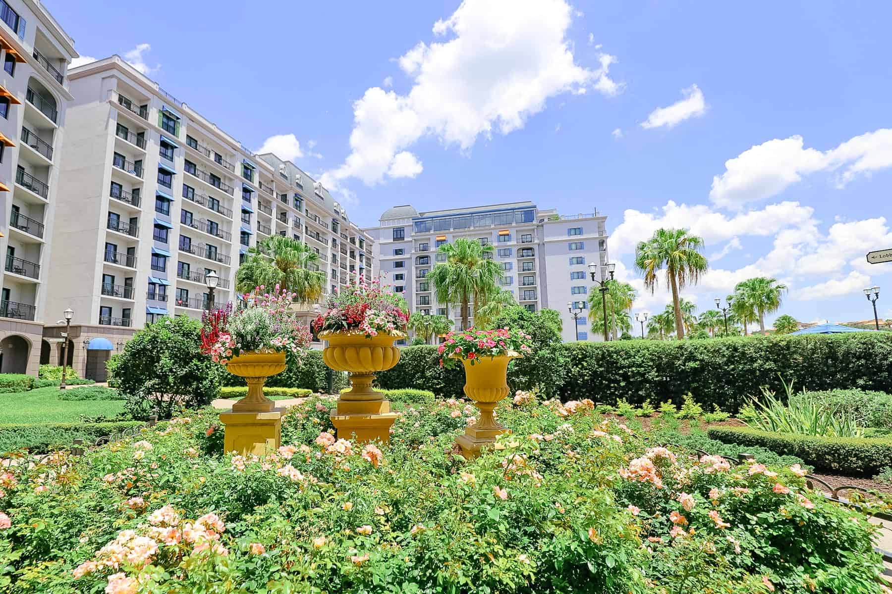 Disney's Riviera Resort with flowers in landscaping. 