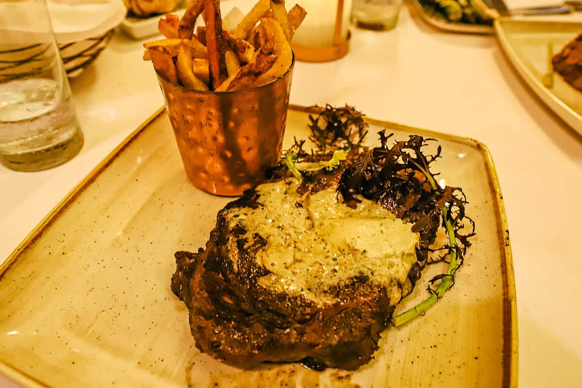 a steak in a cream sauce at a fine dining location 