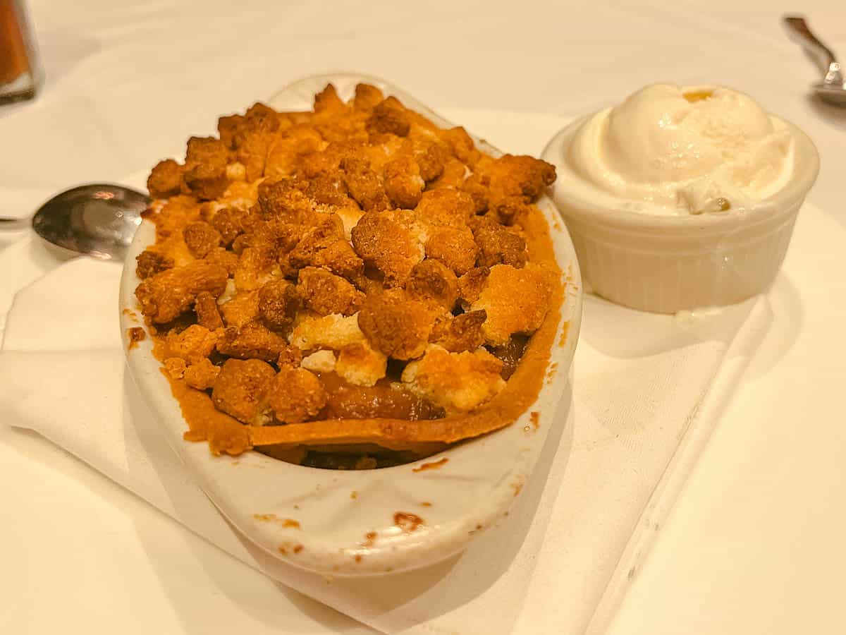 a dessert of apple crumble with ice cream from a signature restaurant at Disney World 