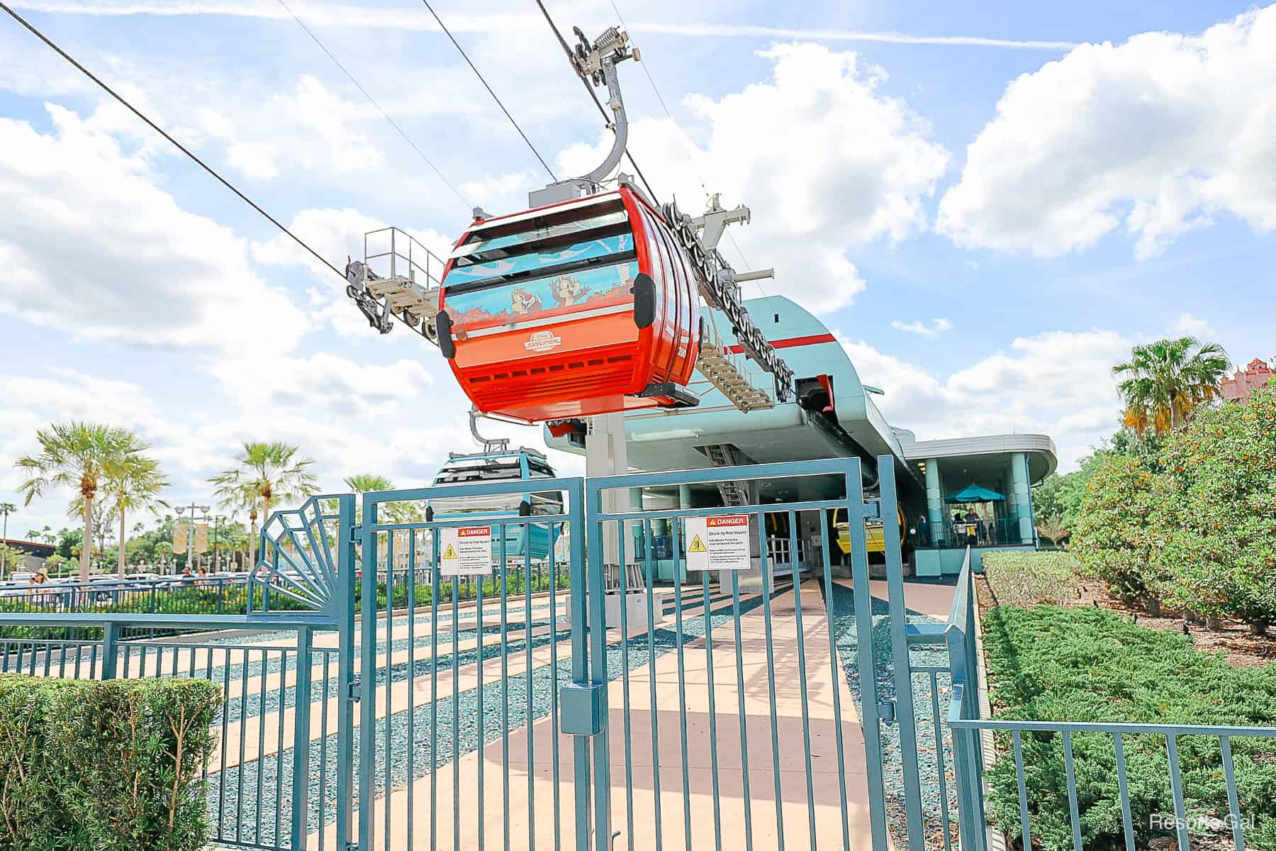 two gondolas entering and leaving the Skyliner station at Disney's Hollywood Studios 