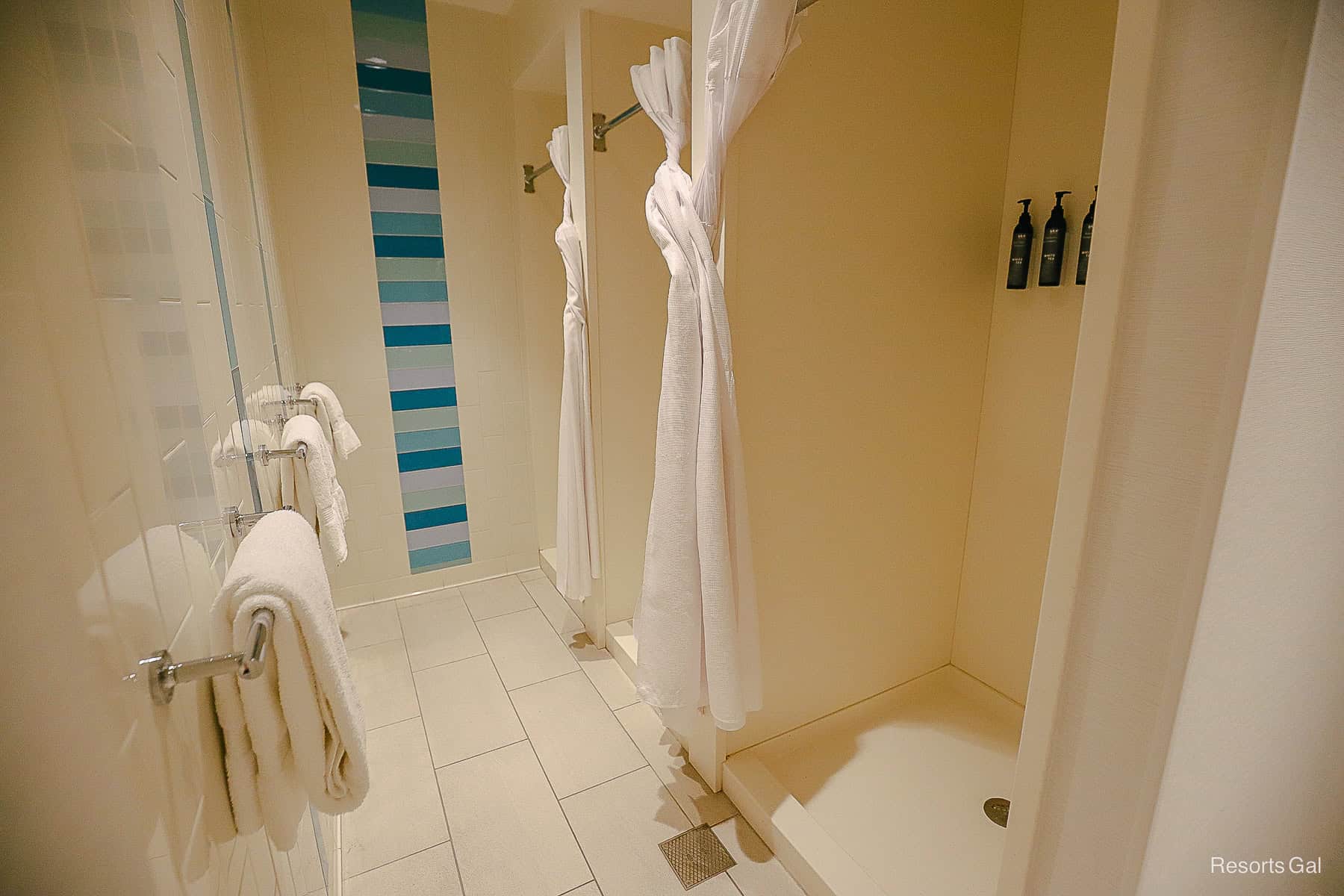 a walk-in shower with toiletries at the Swan and Dolphin Pool 