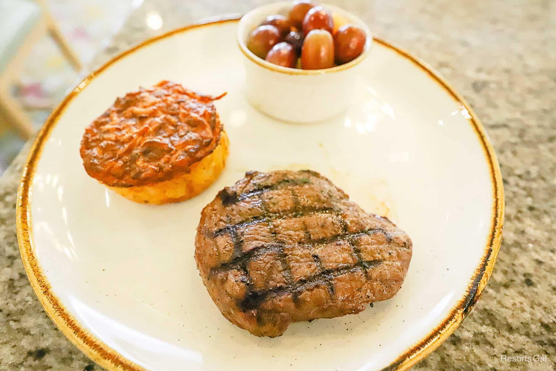 a brunch dish with steak and hash brown casserole from Grand Floridian Cafe hotel restaurant 