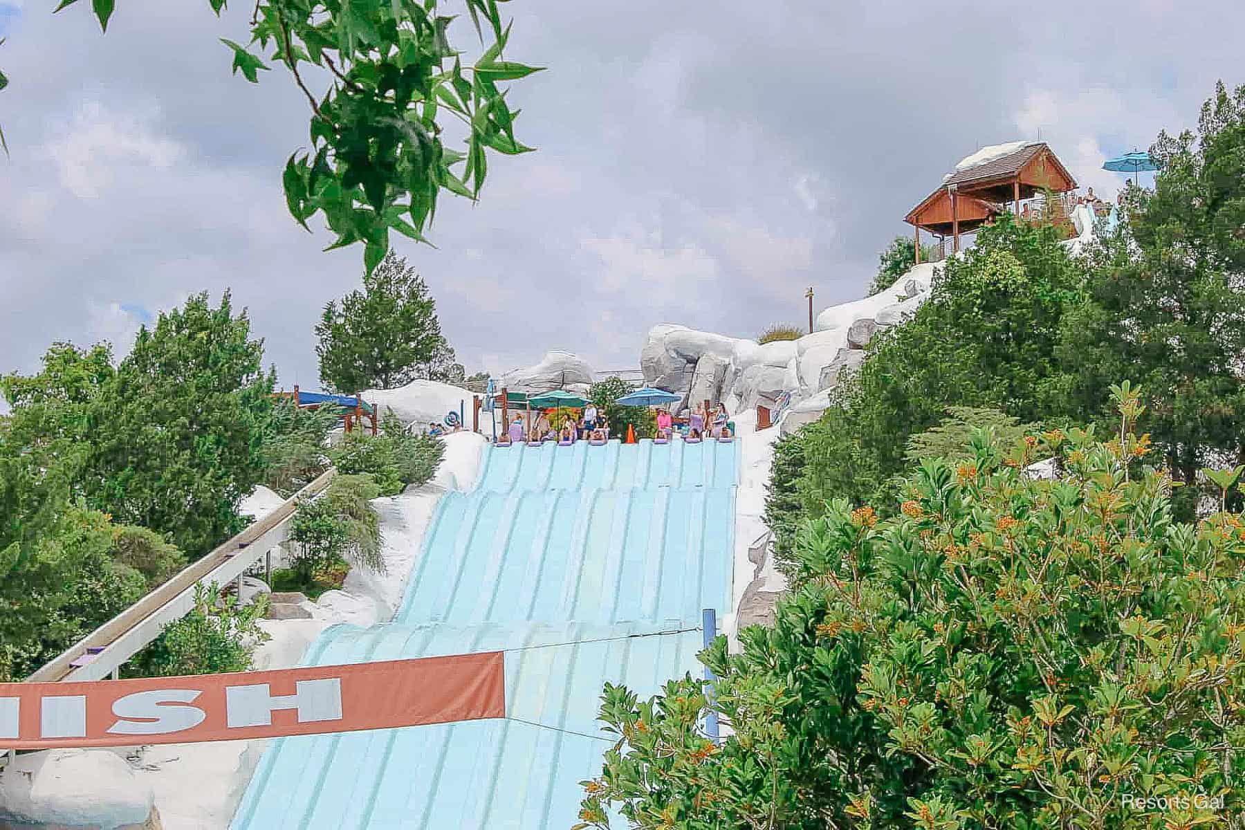 guests lining up their mats to ride down the slide 