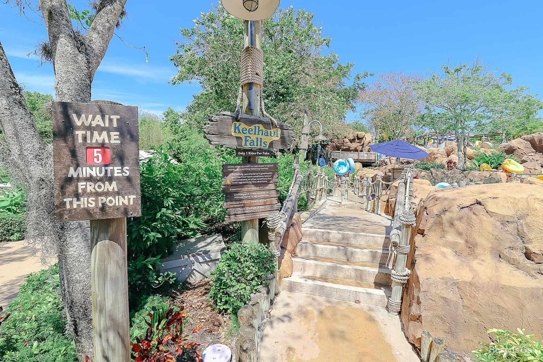 the entrance to Keelhaul Falls at Typhoon Lagoon with posted wait time sign 