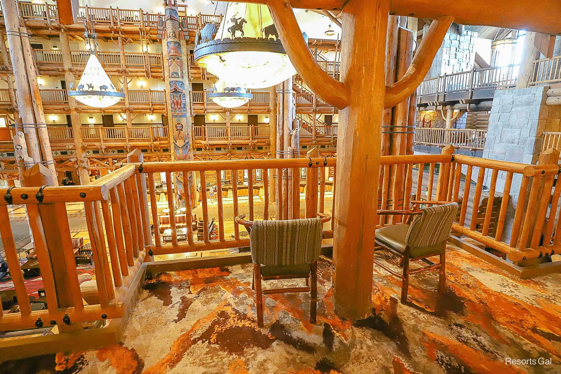 two seats that face the lobby balcony on an upper floor of the Wilderness Lodge 