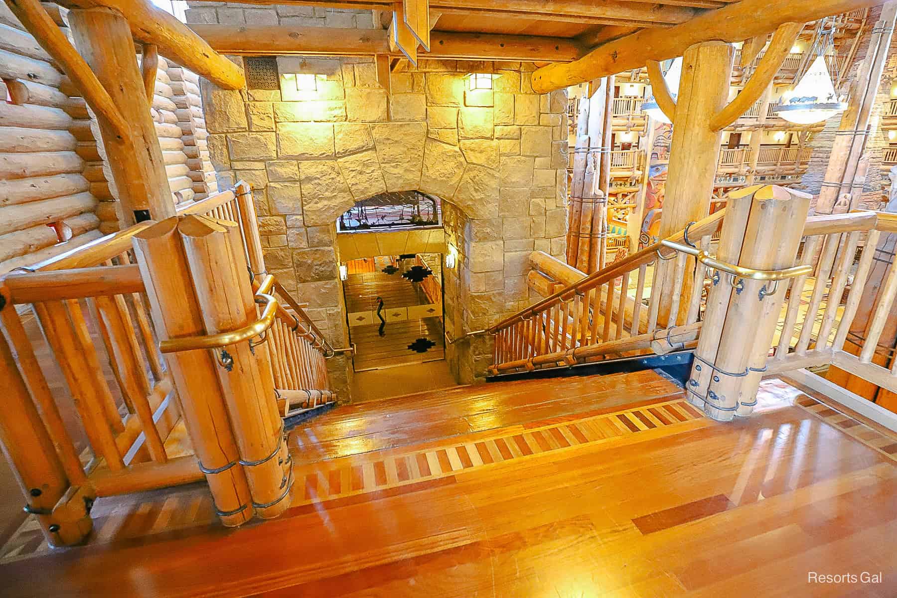 opposite side once you cross through the indoor/outdoor area of the Wilderness Lodge lobby staircase 