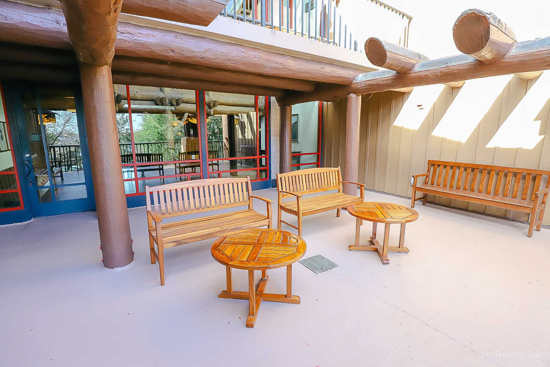 tables and benches for guests to relax on outdoor decks of Wilderness Lodge 