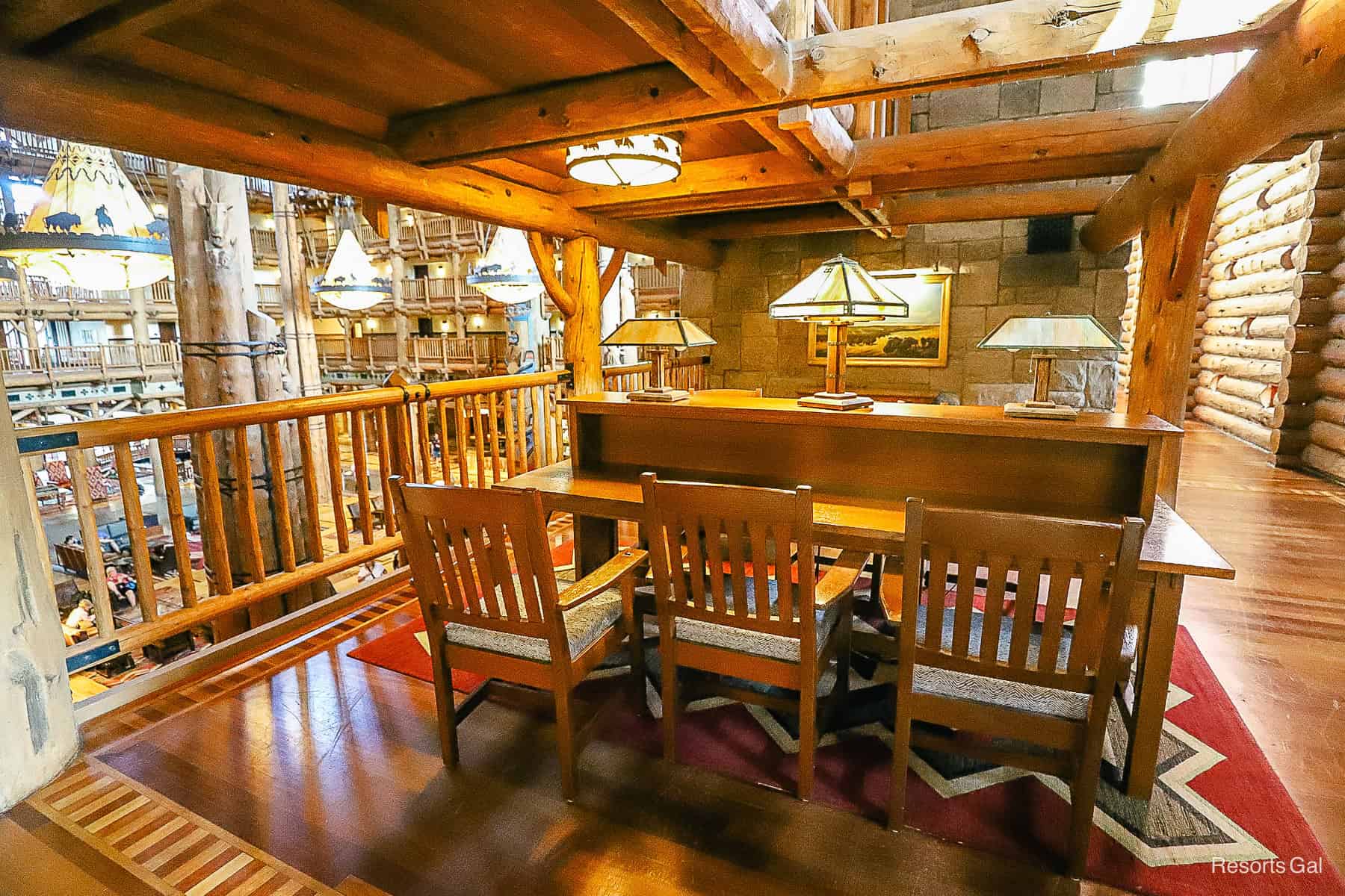 a desk style table with work stations for guests to use in the Wilderness Lodge 