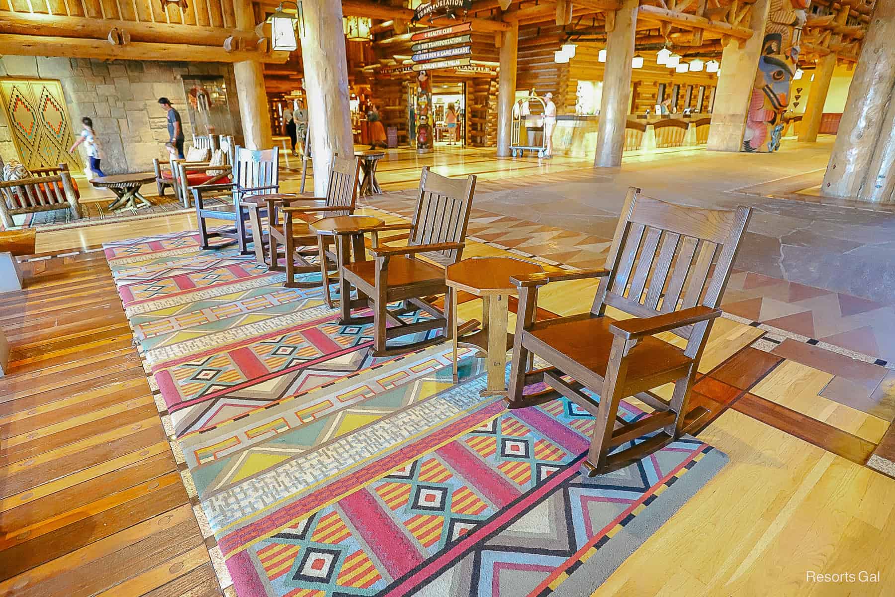 a row of wooden rockers facing the hot springs 