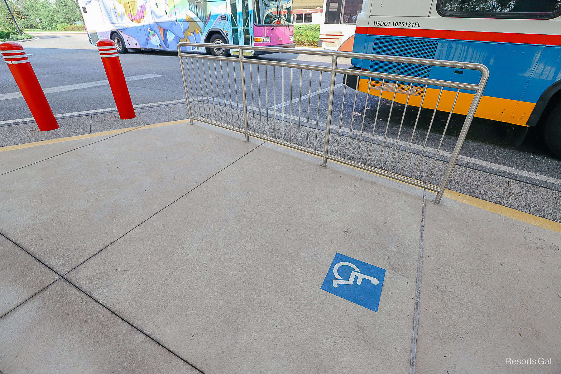 a handicap accessible waiting area at a Disney World bus stop