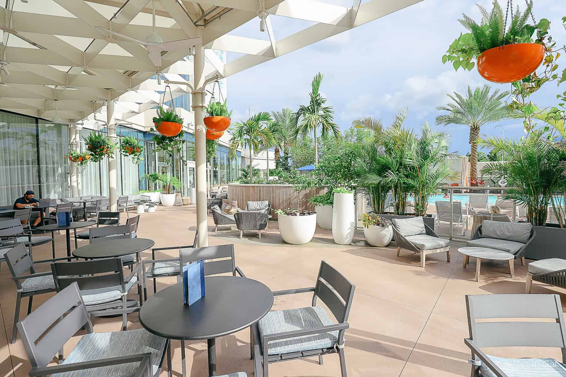 a partially covered area with tables and chairs at the Swan Reserve 