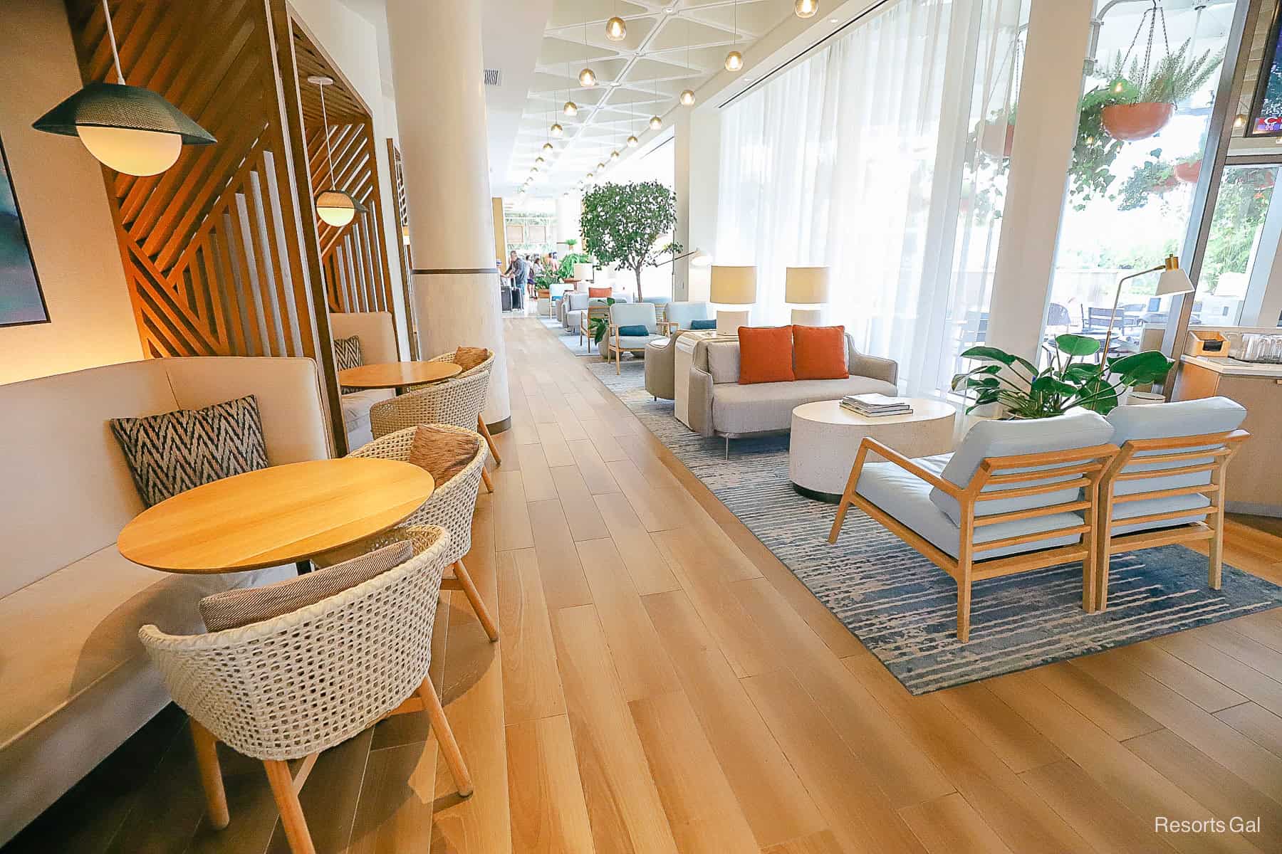 a lobby area with casual seating, tables and chairs for dining at the Swan Reserve 