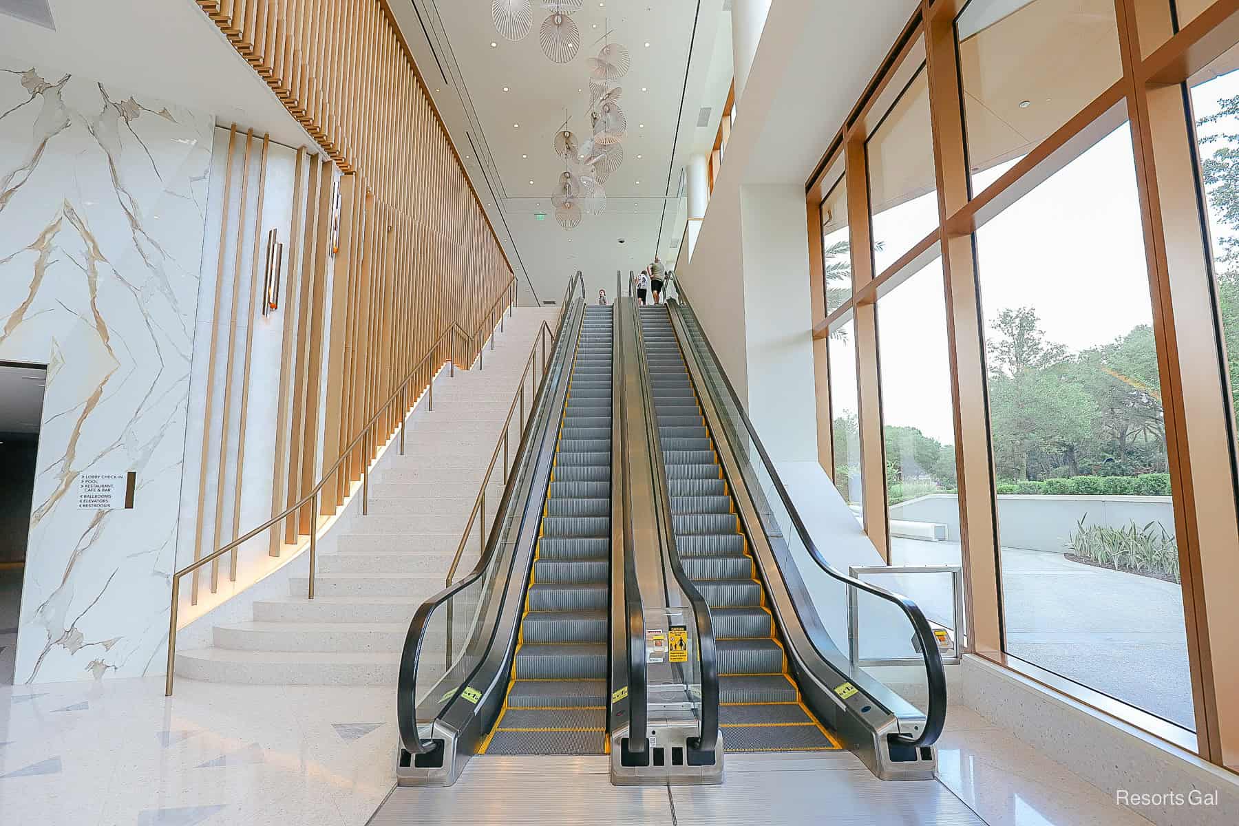 escalators leading up to the third floor of the Swan Reserve 