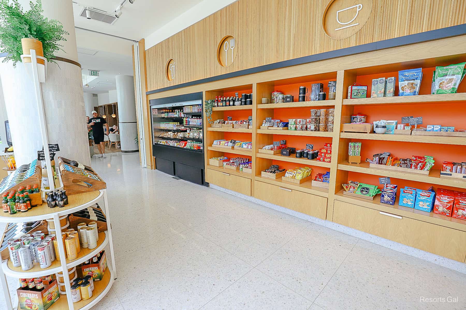 the interior of Grounds Coffee with shelves of pre-packaged food items at the Swan Reserve